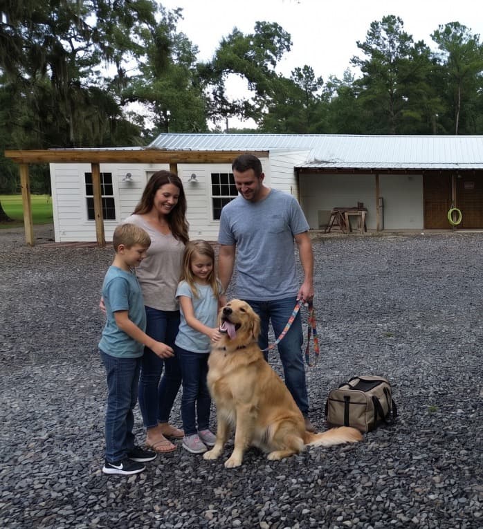 A family with their dog outside the RH Boarding Co. facility in Richmond Hill